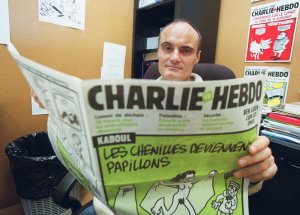 Photo prise le 22 novembre 2001 à Paris du rédacteur en chef du journal Charlie Hebdo, Philippe Val. Photo : FRANCOIS GUILLOT / AFP)